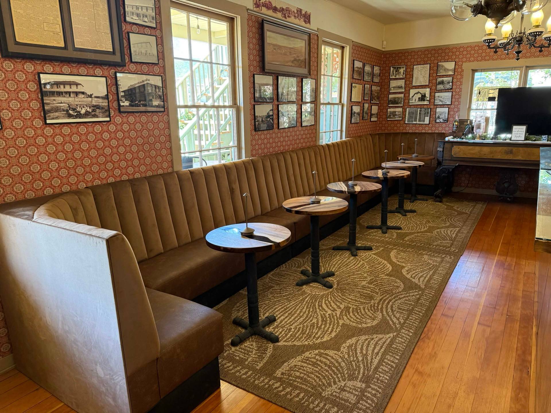 Big Nose Winery tasting room with banquette seating and historic Temecula photos